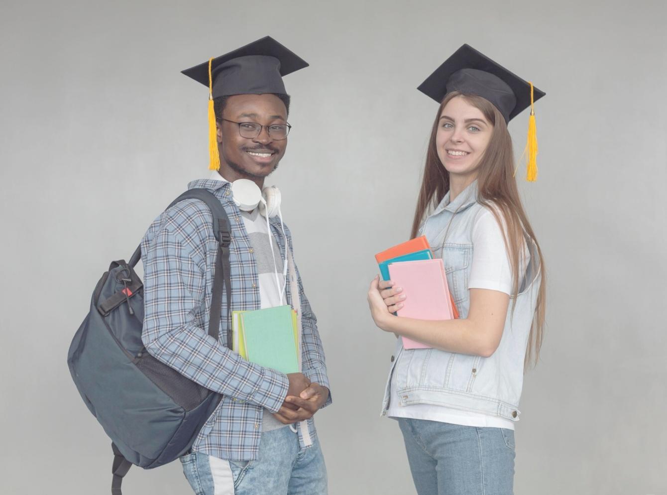 Students analyzing keyword research data on multiple screens during practical workshop session